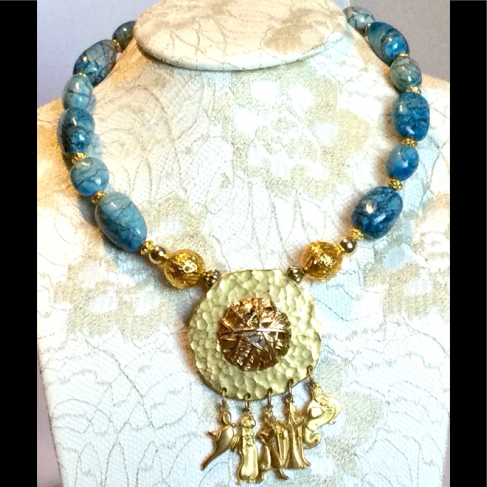 Blue stone necklace with Disney pendant.